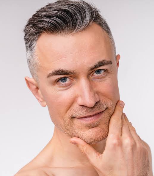 Man with defined jawline representing natural-looking male facial rejuvenation